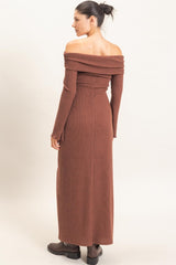 woman wearing a brown off-the-shoulder ribbed maxi dress with long sleeves from the back