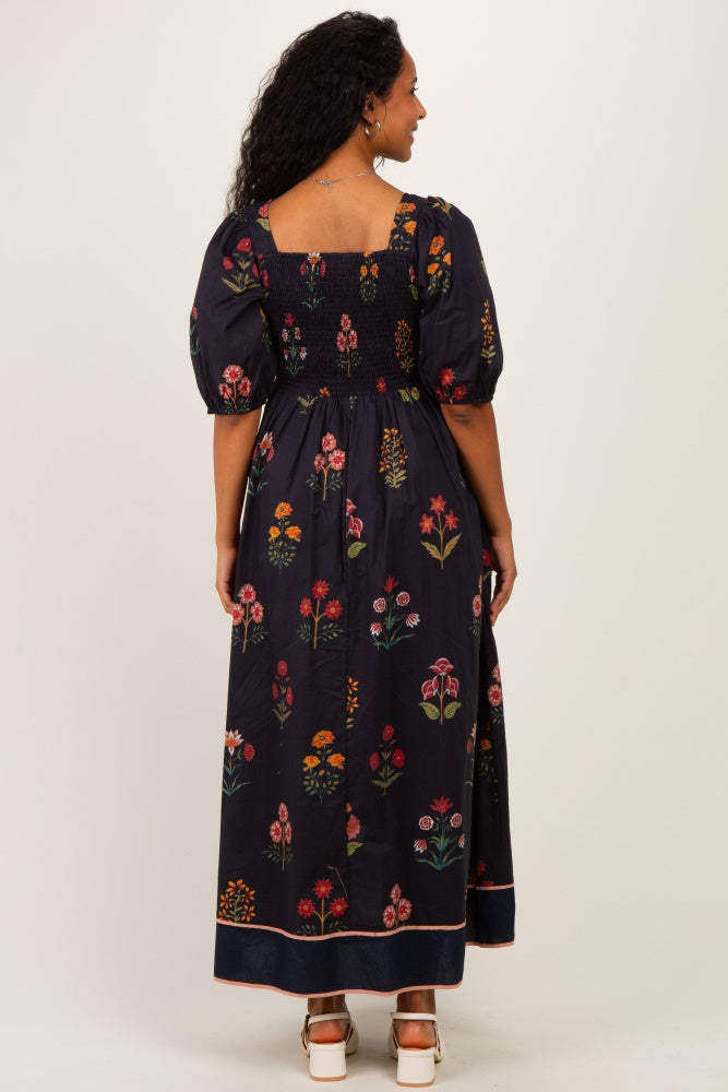 maternity wear floral maxi dress with puffed sleeves and smocked back, model shown from behind