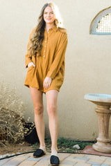 woman wearing a mustard yellow button-up shirt dress with pockets and black slip-on shoes