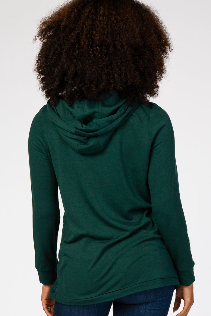 woman wearing a dark green long sleeve hooded sweatshirt, viewed from the back