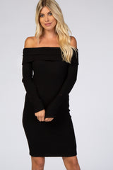 woman wearing a black off-the-shoulder ribbed midi dress with long sleeves