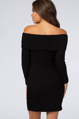 back view of a woman wearing a black off-the-shoulder long sleeve ribbed mini dress