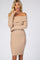 woman wearing a beige off-shoulder ribbed bodycon dress