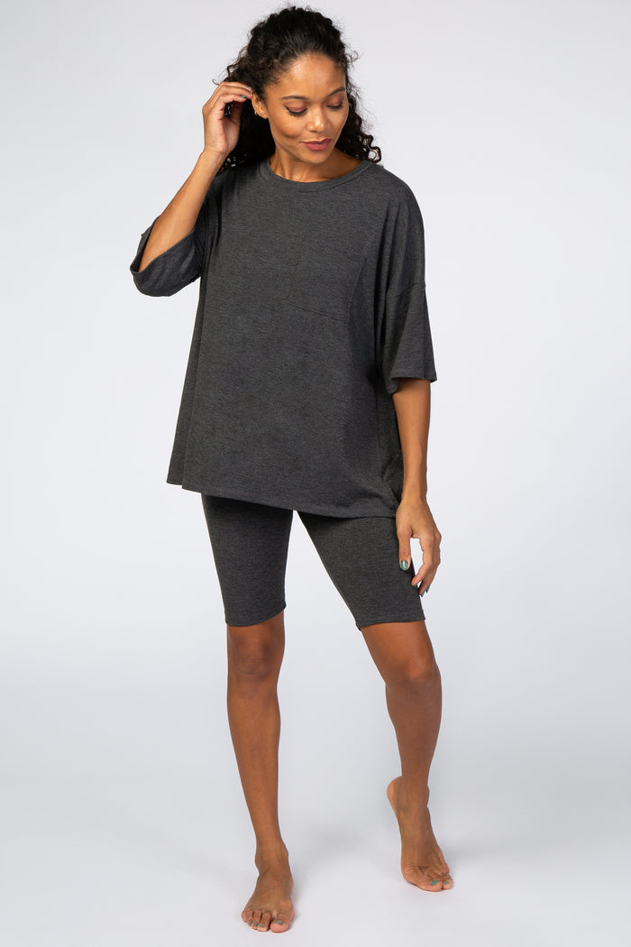 woman wearing charcoal grey oversized pocket tee and matching biker shorts lounge set