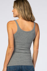 Back view of a woman wearing a grey ribbed scoop neck tank top and blue jeans