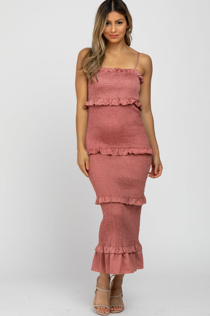 woman wearing a dusty rose midi dress with ruffle tiers and spaghetti straps