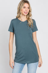 woman wearing a teal short sleeve t-shirt with a round neckline and casual fit