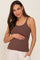 woman wearing a brown ribbed maternity tank top and holding her baby bump