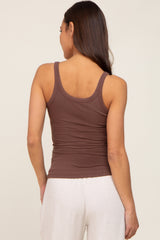 woman wearing a brown ribbed maternity tank top, showing the back view