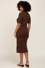 woman wearing a chocolate brown ribbed midi dress with short sleeves and a subtle fitted silhouette