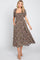woman wearing a black floral midi dress with puff sleeves and pockets