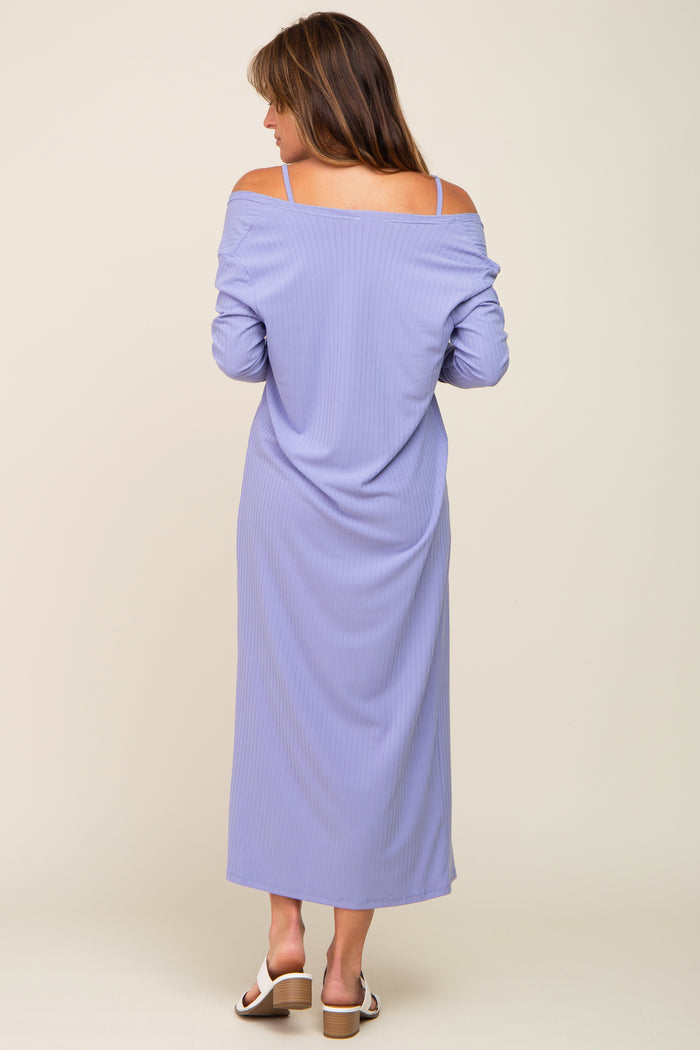 woman wearing a lavender off-the-shoulder maxi dress with long sleeves and a relaxed fit