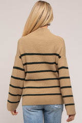 woman wearing a tan and green striped maternity sweater with a relaxed fit and wide sleeves, viewed from the back