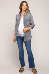 woman wearing a grey denim maternity shirt and a white tank top with a visible baby bump, paired with blue jeans
