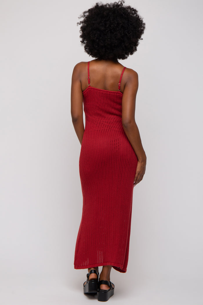 woman wearing a red ribbed maxi dress with thin straps, view from the back