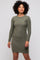 woman wearing a dark green long sleeve checkered mini dress with a fitted silhouette