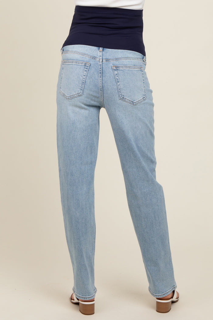 maternity wear in light blue straight leg jeans with a dark blue supportive waistband, model viewed from the back