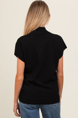 woman wearing a black short sleeve maternity sweater, seen from the back